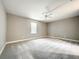 Bedroom with ceiling fan and carpeting at 501 Mulberry St, Fruitland Park, FL 34731