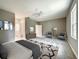 Spacious bedroom featuring neutral colors, ceiling fan, and decorative rugs at 501 Mulberry St, Fruitland Park, FL 34731