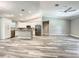 Spacious kitchen with stainless steel appliances, granite counters, and open layout perfect for entertaining and cooking at 501 Mulberry St, Fruitland Park, FL 34731