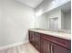 Bathroom that features double sinks with granite countertops and an enclosed glass shower at 509 Mulberry St, Fruitland Park, FL 34731