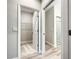 Hallway view of a walk-in closet and an ensuite bathroom at 509 Mulberry St, Fruitland Park, FL 34731