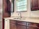 Kitchen with stainless steel appliances, granite countertops, and dark wood cabinets at 509 Mulberry St, Fruitland Park, FL 34731