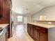 Open concept living space with granite countertops and stainless steel appliances at 509 Mulberry St, Fruitland Park, FL 34731