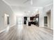 Spacious, open-concept layout with modern kitchen, stainless appliances, and ample natural light at 509 Mulberry St, Fruitland Park, FL 34731