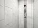 Enclosed shower features large tiling, modern fixtures, and a gray accent stripe at 509 Mulberry St, Fruitland Park, FL 34731