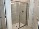 Modern glass-enclosed shower with tile surround, chrome fixtures, and tile floor at 618 Duke Dr, Haines City, FL 33844