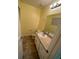 Bathroom showcasing a vanity with light speckled countertop, toilet and window at 6427 Breezewood St, Orlando, FL 32818