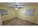 Comfortable bedroom with tile floors, ceiling fan and plenty of natural light at 6427 Breezewood St, Orlando, FL 32818