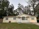 Charming single-story home with a well-maintained front yard and cozy porch at 6427 Breezewood St, Orlando, FL 32818
