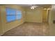 Inviting living room with tile flooring, bright walls and natural light at 6427 Breezewood St, Orlando, FL 32818