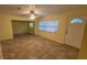 Open-concept living area featuring tile flooring and natural light at 6427 Breezewood St, Orlando, FL 32818