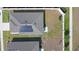 Birds eye view of rooftop with installed solar panels above patio at 660 Silver Palm Dr, Haines City, FL 33844