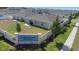 Aerial view of Cypress Park Estates community sign, privacy fence, and well-maintained backyard at 660 Silver Palm Dr, Haines City, FL 33844