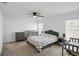 Serene bedroom featuring carpet, fan, neutral tones, and ample natural light from the dual window arrangement at 660 Silver Palm Dr, Haines City, FL 33844