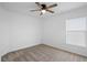 Bedroom with neutral carpet, a ceiling fan, and a bright window at 660 Silver Palm Dr, Haines City, FL 33844