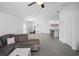 Open concept living room featuring tile floors connecting kitchen with island and comfortable seating area at 660 Silver Palm Dr, Haines City, FL 33844
