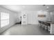 Open-concept layout showcasing tile flooring and inviting living space leading to the kitchen at 660 Silver Palm Dr, Haines City, FL 33844