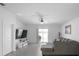 Spacious living room with tile floors, a sliding glass door, and a comfortable sectional sofa at 660 Silver Palm Dr, Haines City, FL 33844