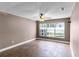 Spacious bedroom with ceiling fan and bright window at 745 Riggs Cir, Davenport, FL 33897