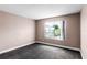 This carpeted bedroom features a large window with plenty of natural light at 745 Riggs Cir, Davenport, FL 33897