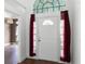 Elegant front door with decorative glass, sidelights, and beautiful tiled flooring at 745 Riggs Cir, Davenport, FL 33897