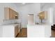 Bright kitchen features wooden floors, white countertops and modern appliances at 745 Riggs Cir, Davenport, FL 33897