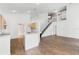 Open-concept living area with tile floors and staircase at 745 Riggs Cir, Davenport, FL 33897