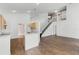 Open-concept living area with tile floors and staircase at 745 Riggs Cir, Davenport, FL 33897