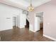 Spacious living room with tile floors, a staircase, and an open view of the kitchen at 745 Riggs Cir, Davenport, FL 33897