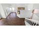 Open-concept living area with tile floors and staircase at 745 Riggs Cir, Davenport, FL 33897