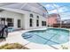 A sunny, screened-in pool with a deck and steps leads to the water at 745 Riggs Cir, Davenport, FL 33897
