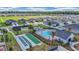 Aerial view of community pool, shuffleboard, and tennis courts surrounded by single-Gathering homes and mature landscaping at 7536 Sw 77Th Ave, Ocala, FL 34481