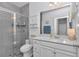 Bright bathroom featuring a glass shower, white cabinets, and modern fixtures at 7536 Sw 77Th Ave, Ocala, FL 34481