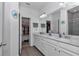 Modern bathroom boasts double sinks, white cabinets, and a walk-in closet at 7536 Sw 77Th Ave, Ocala, FL 34481