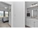 Bright and airy bathroom with modern fixtures and a glimpse into the adjacent bedroom at 7536 Sw 77Th Ave, Ocala, FL 34481