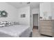 Bright bedroom featuring neutral paint, light gray accents, and a view to the hallway at 7536 Sw 77Th Ave, Ocala, FL 34481