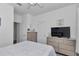 Bedroom showcasing neutral decor, bright lighting, and doors leading to other rooms at 7536 Sw 77Th Ave, Ocala, FL 34481