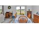 Dining area with table and chairs, view of the backyard through sliding glass doors at 7536 Sw 77Th Ave, Ocala, FL 34481