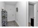 Clean entryway with neutral walls, decor, and tile floors leads into the home at 7536 Sw 77Th Ave, Ocala, FL 34481