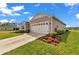 Charming single-Gathering home with a two-car garage, well-manicured landscaping, and a concrete driveway at 7536 Sw 77Th Ave, Ocala, FL 34481