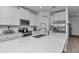 Modern kitchen featuring white cabinets, stainless steel appliances, and quartz countertops at 7536 Sw 77Th Ave, Ocala, FL 34481