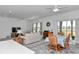 Open-concept living room with tile flooring, lots of seating and a dining area at 7536 Sw 77Th Ave, Ocala, FL 34481