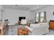 Bright living room features neutral decor, tile floors, and comfortable seating at 7536 Sw 77Th Ave, Ocala, FL 34481