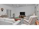 Comfortable living room with lots of natural light, neutral colors, ceiling fan and cozy furniture at 7536 Sw 77Th Ave, Ocala, FL 34481