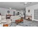Spacious living area connects to the kitchen, featuring tile floors and ample seating at 7536 Sw 77Th Ave, Ocala, FL 34481
