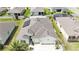 Aerial view of a beautiful home with solar panels, a well-manicured lawn, and a brick driveway at 9210 Sw 60Th Court Rd, Ocala, FL 34476
