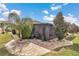 Landscaped backyard with a screened-in patio and decorative pavers, creating a private oasis at 9210 Sw 60Th Court Rd, Ocala, FL 34476