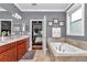 Elegant bathroom with double sinks, soaking tub, and views into the Main bedroom at 9210 Sw 60Th Court Rd, Ocala, FL 34476