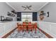 Formal dining room with gray walls, wainscotting, and modern decor is perfect for gatherings at 9210 Sw 60Th Court Rd, Ocala, FL 34476