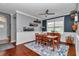 Elegant dining room with hardwood floors, wainscoting, and a large window for natural light at 9210 Sw 60Th Court Rd, Ocala, FL 34476